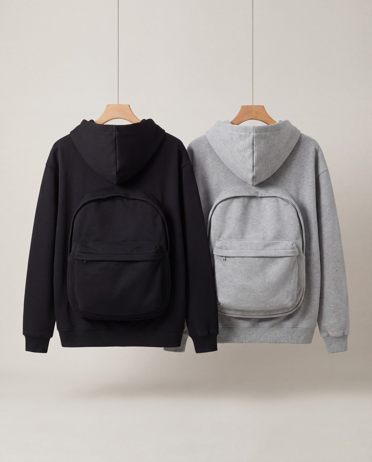PackHoodie in Gray and Black, back view with built-in backpack pouch