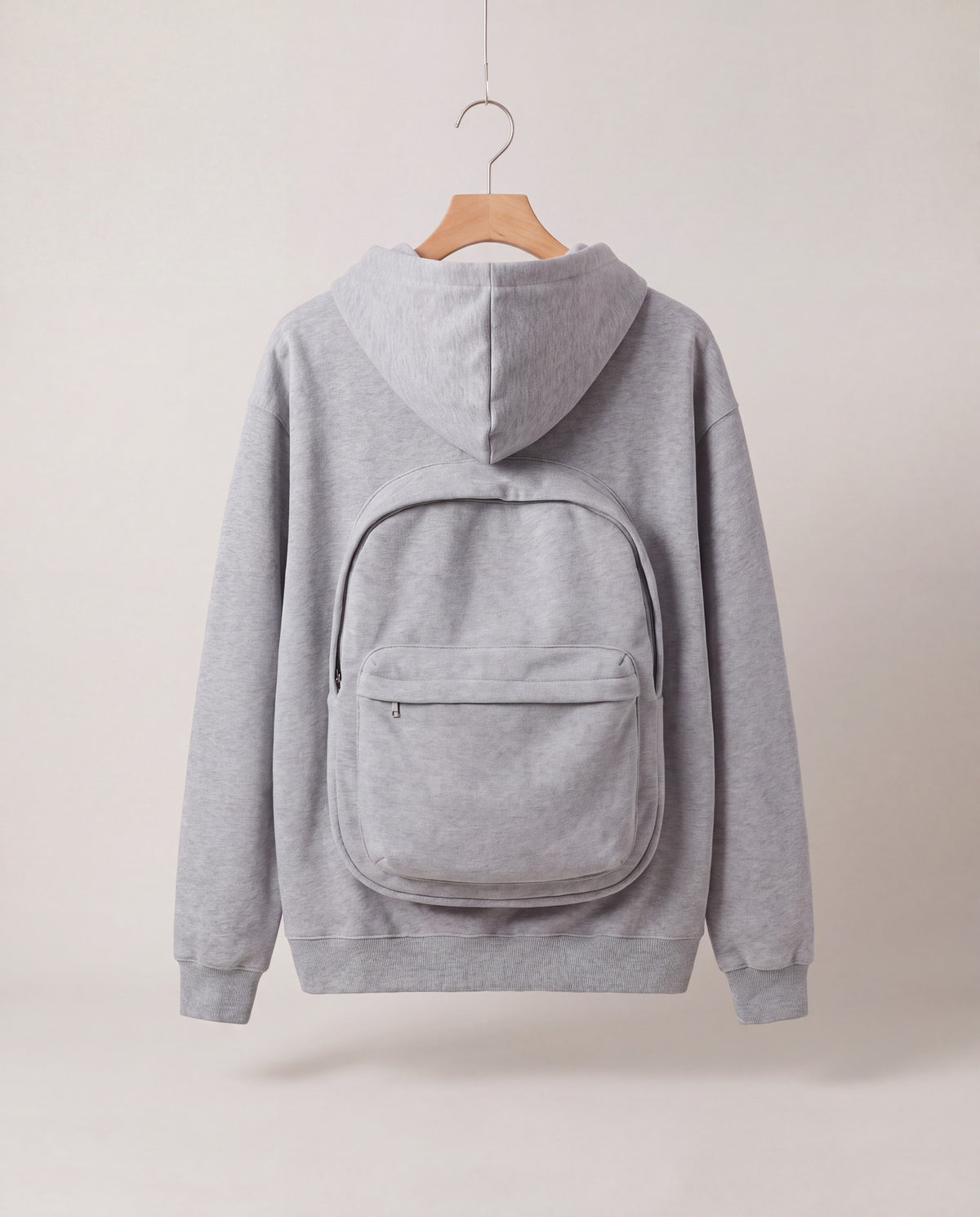 PackHoodie in Gray, back view with built-in backpack pouch